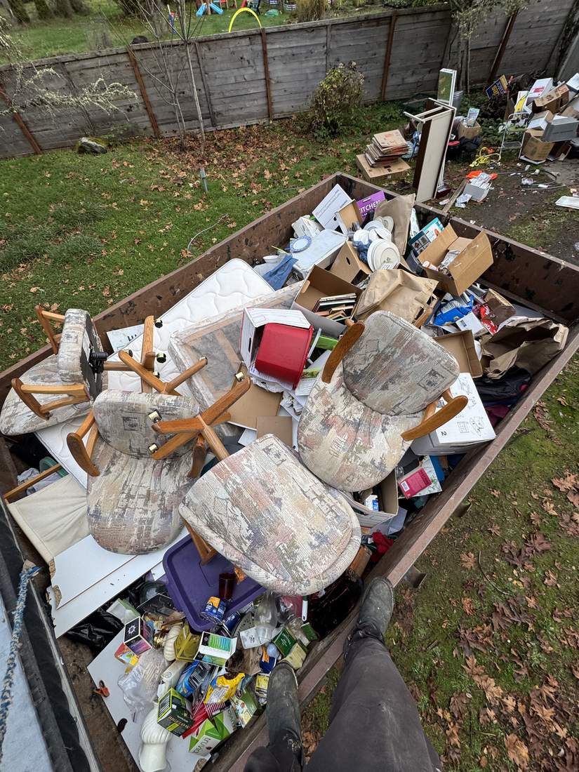 A trailer loaded with furniture and belongings from the property