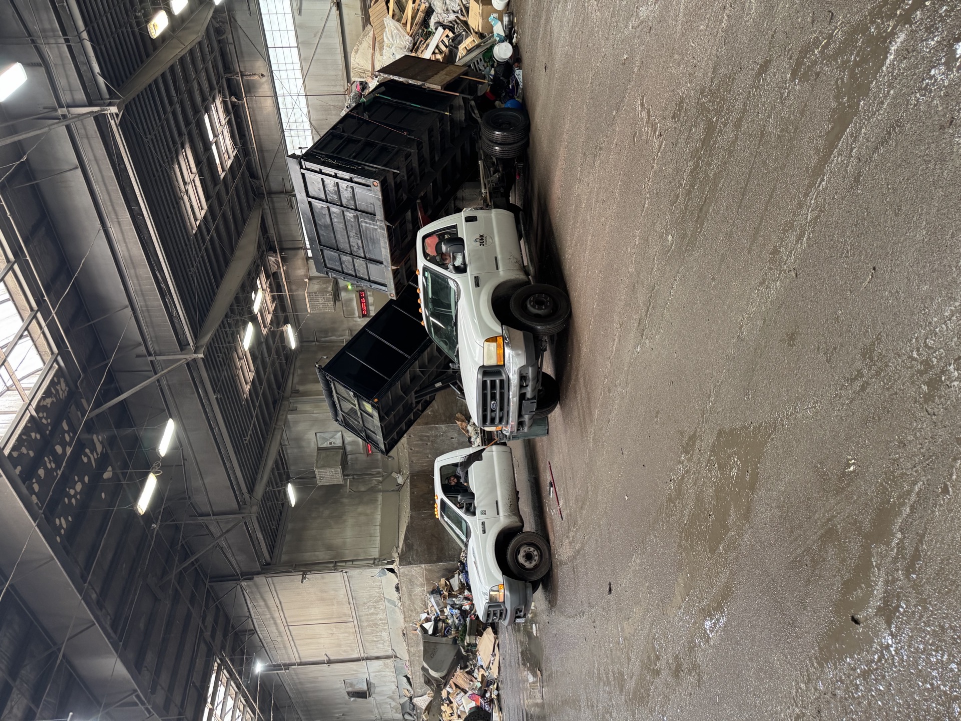 Jake's Junk Removal dump trailer unloading debris